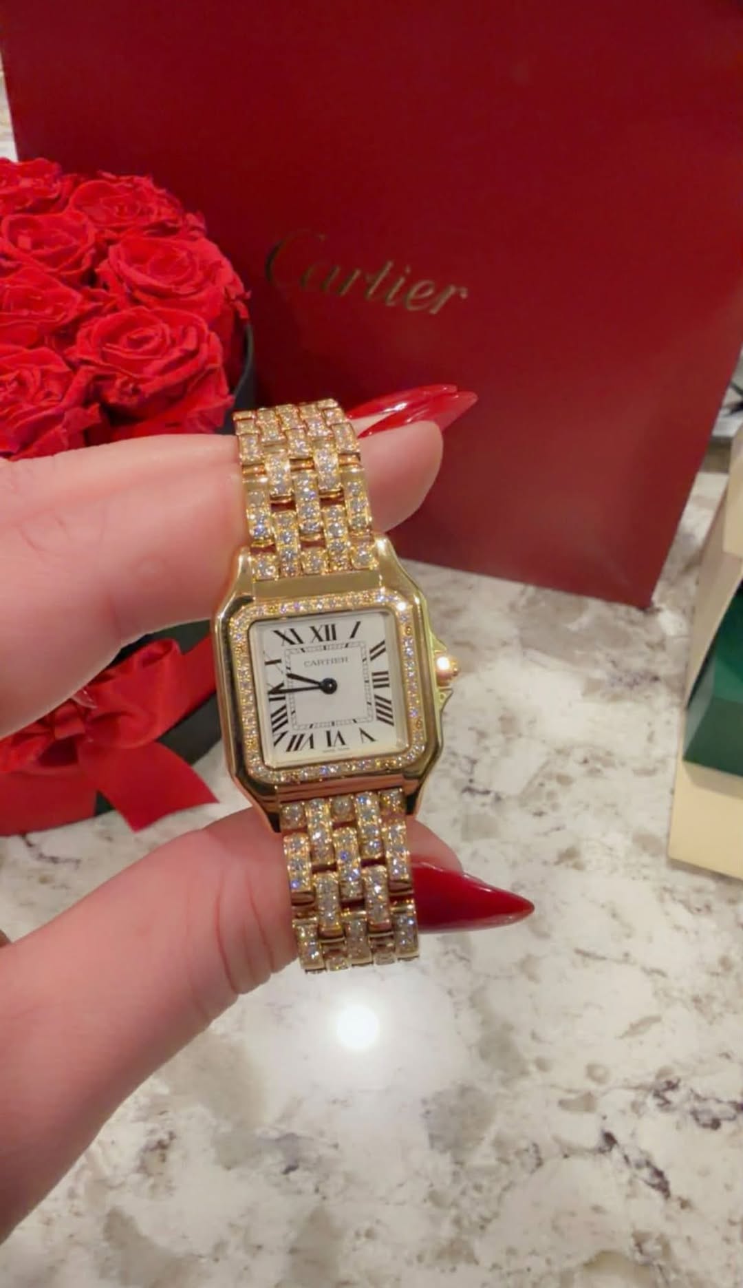 May be an image of wrist watch and text