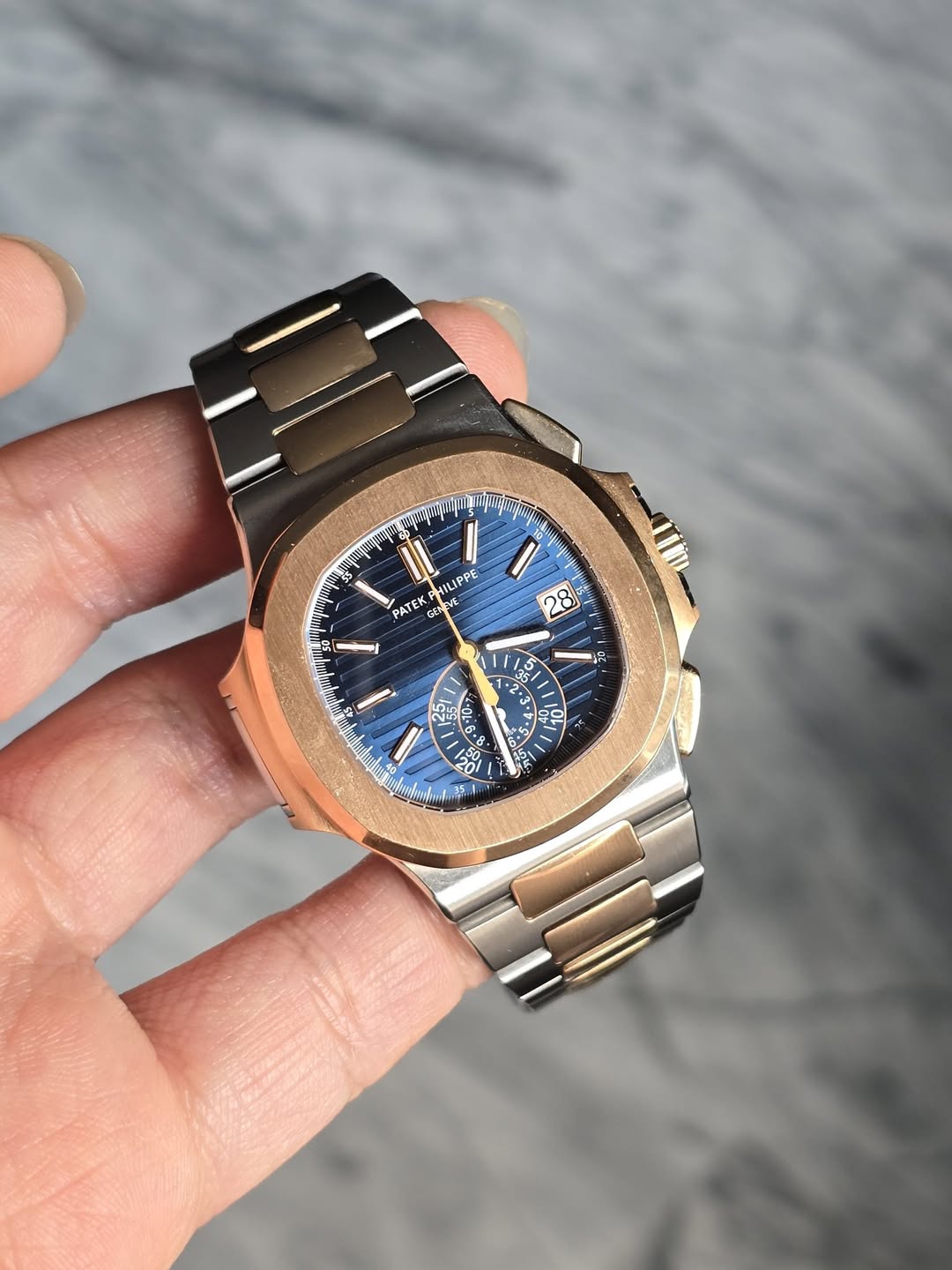 May be an image of wrist watch and text