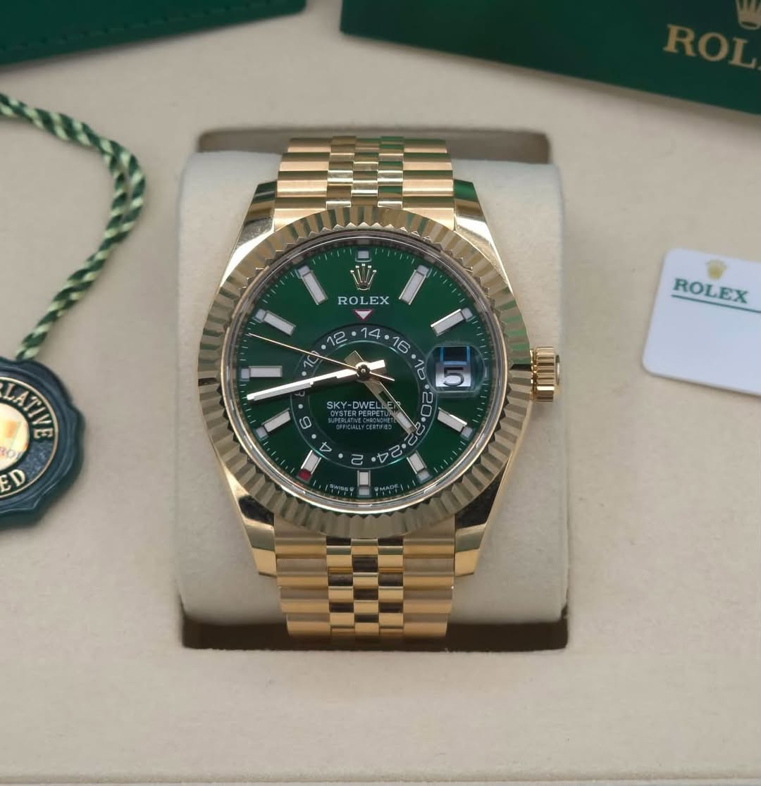 May be an image of wrist watch and text that says 'RO ROLEX EX LATIR ROLEX គ្រី 22 + SKY- D ED 2 Da م لو'