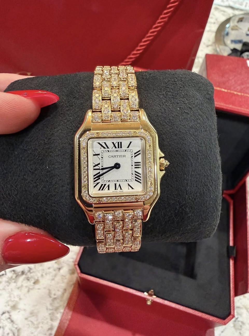 May be an image of wrist watch and text