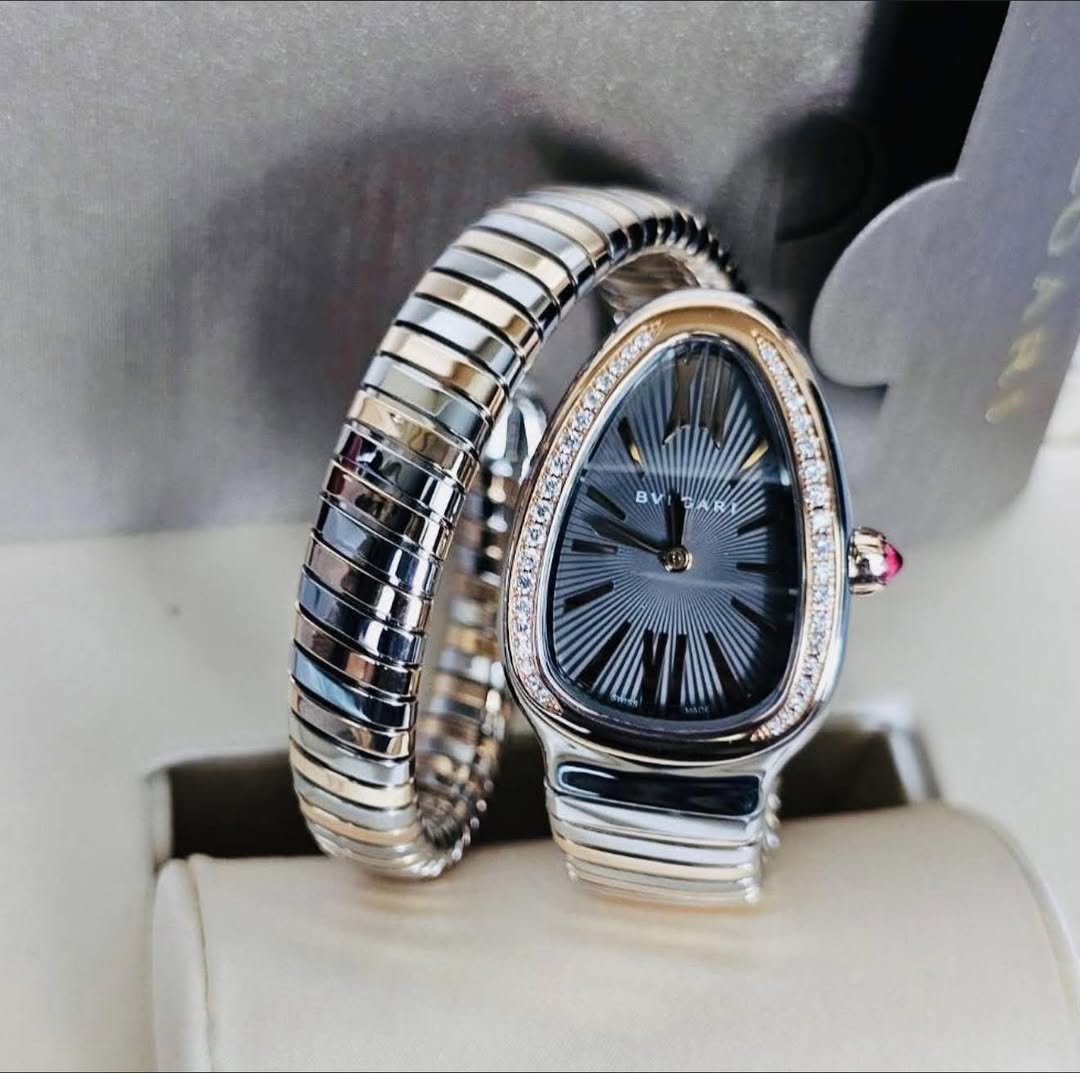 May be an image of digital watch, jewelry and text