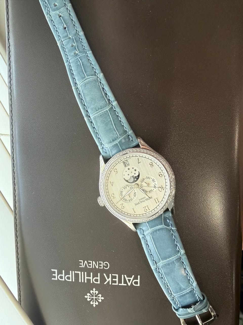 May be an image of wrist watch and text