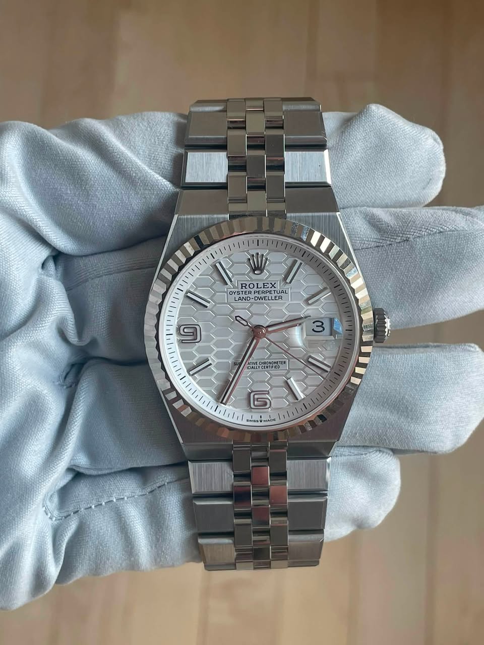 May be an image of wrist watch and text