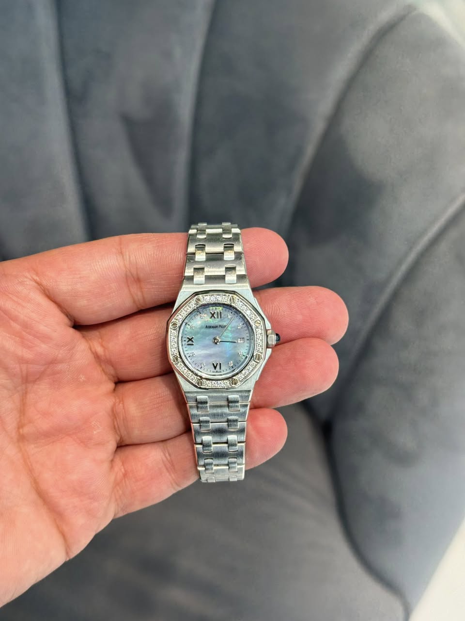 May be an image of wrist watch and text