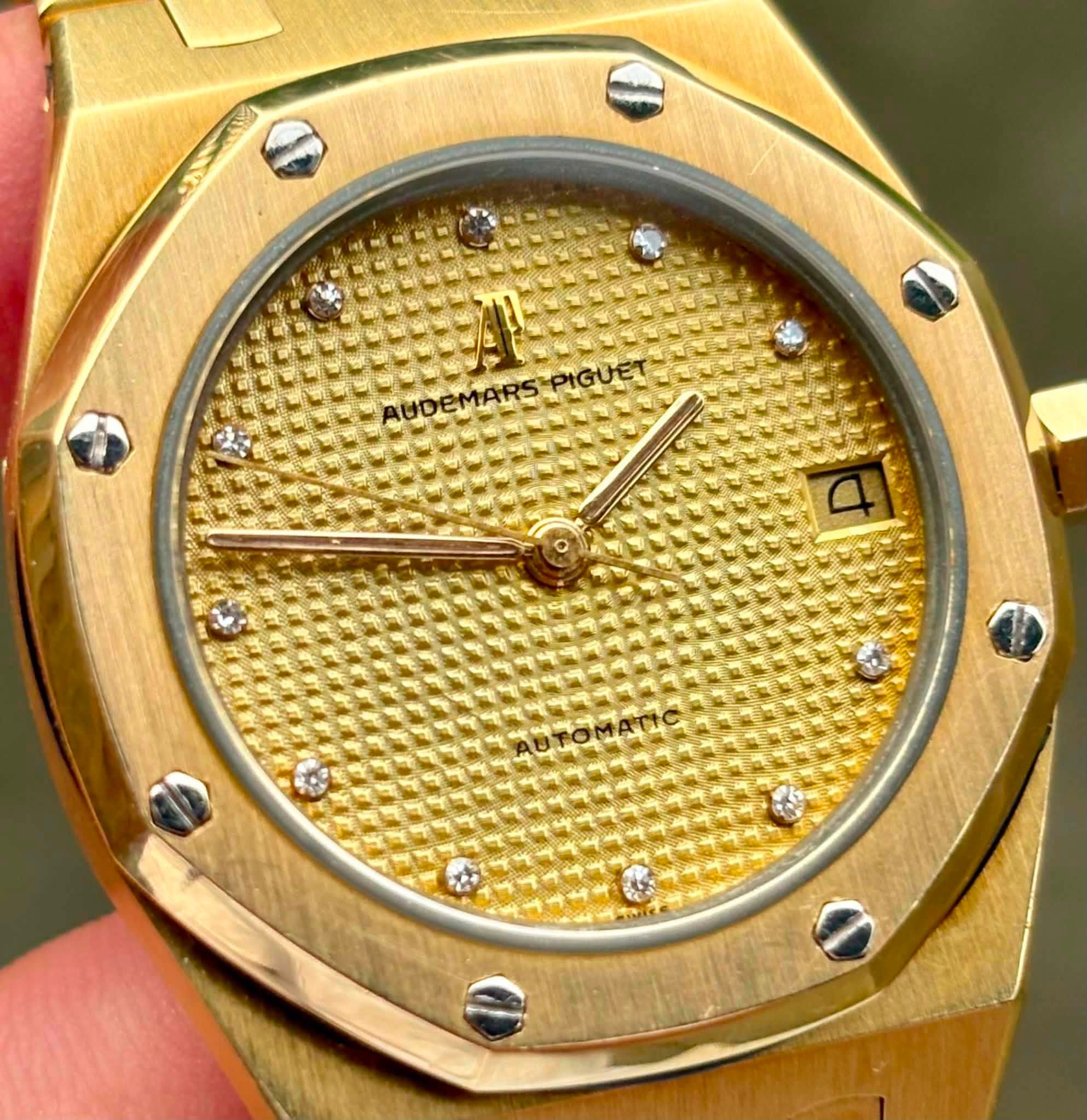 May be an image of wrist watch and text