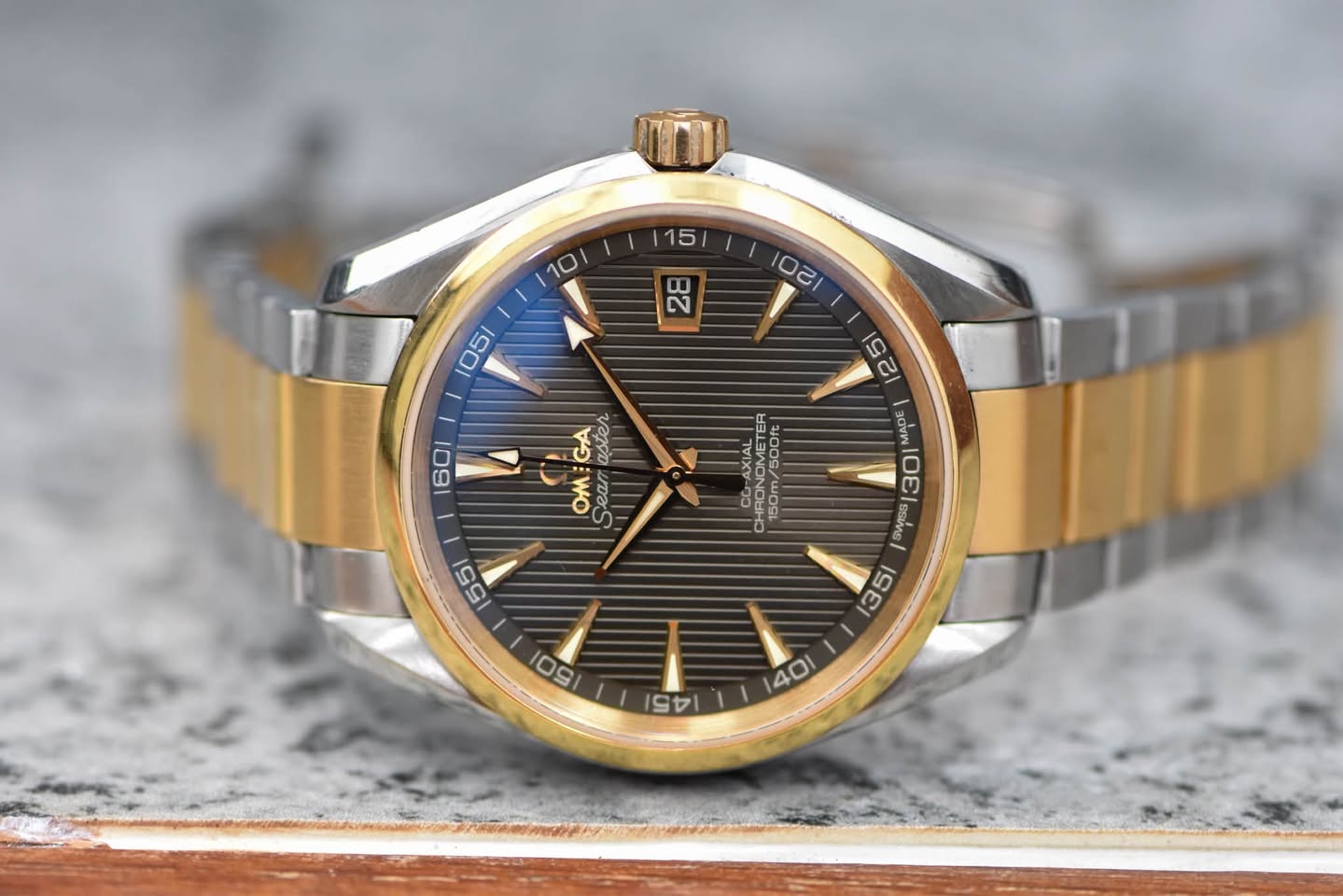 May be an image of wrist watch and text