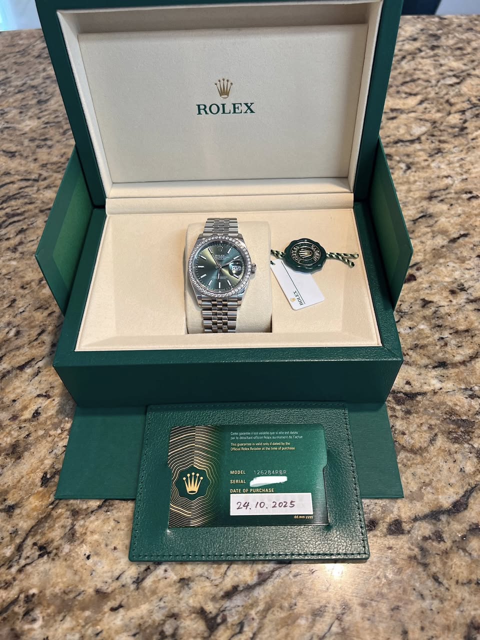 May be an image of wrist watch and text
