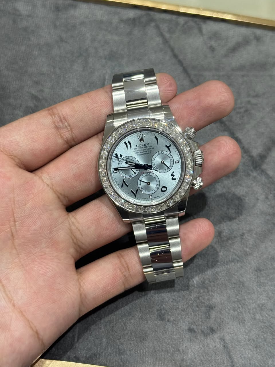 May be an image of wrist watch and text