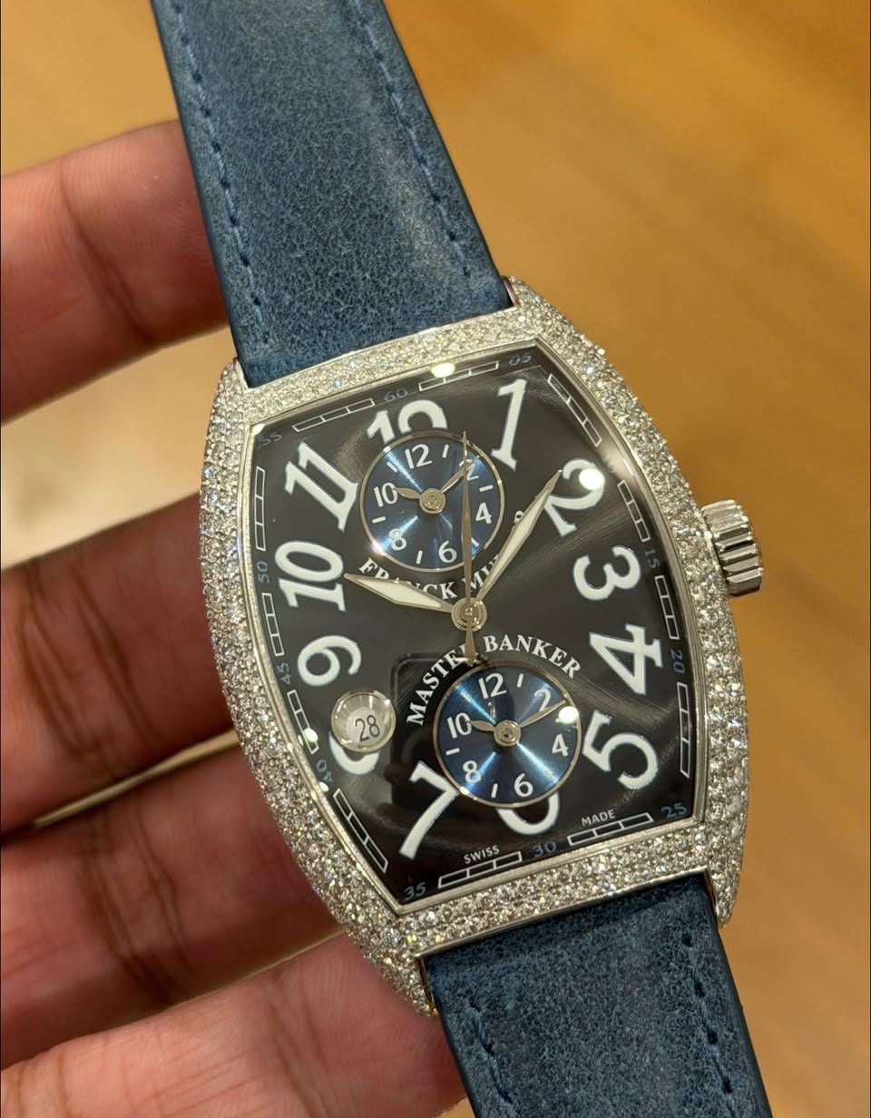 May be an image of wrist watch and text that says 'D 10 12 CD 11 10 ن 之 1 C 4 O 2 S 50 10 EDTICK 6 PDACK F 3 IDD 6 MASTE BANKER さ 28 10 D MADE WISS'