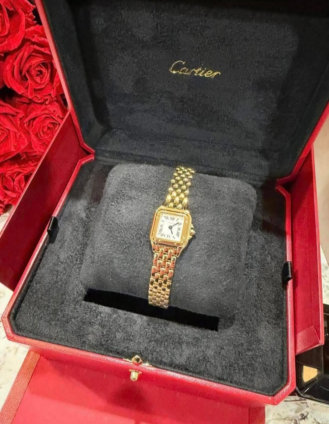 May be an image of wrist watch and text