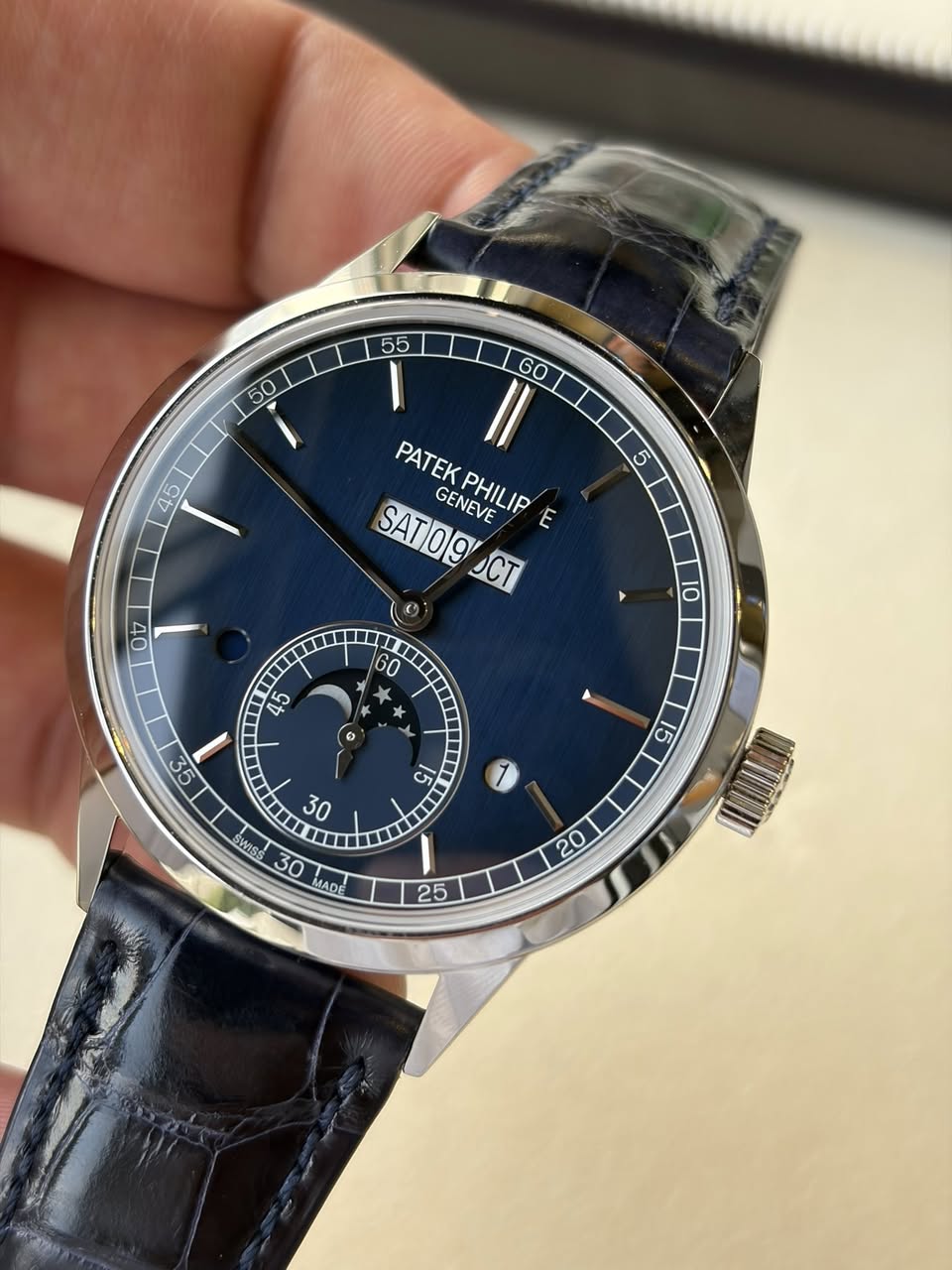 May be an image of wrist watch and text that says ' Il GO PATEK SAT09 GENEVE PHILIP E CT 00 10 60 د X 45 o C& MIS SMeS LuSS 5 5 MADE 30 0 25'