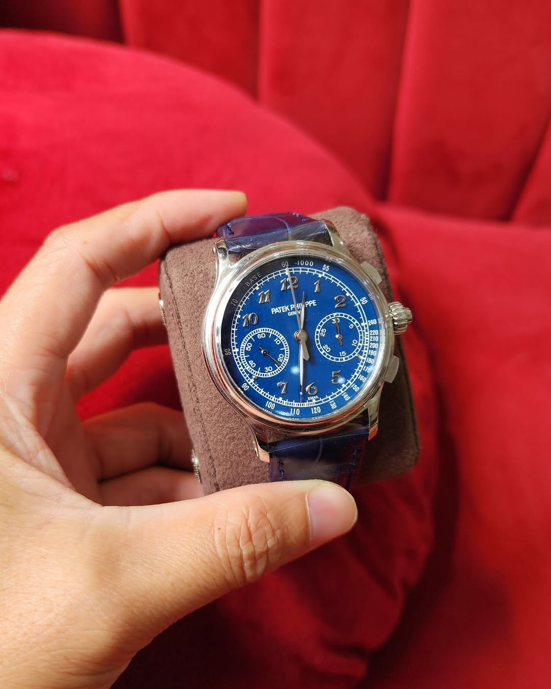 May be an image of wrist watch, leather and text