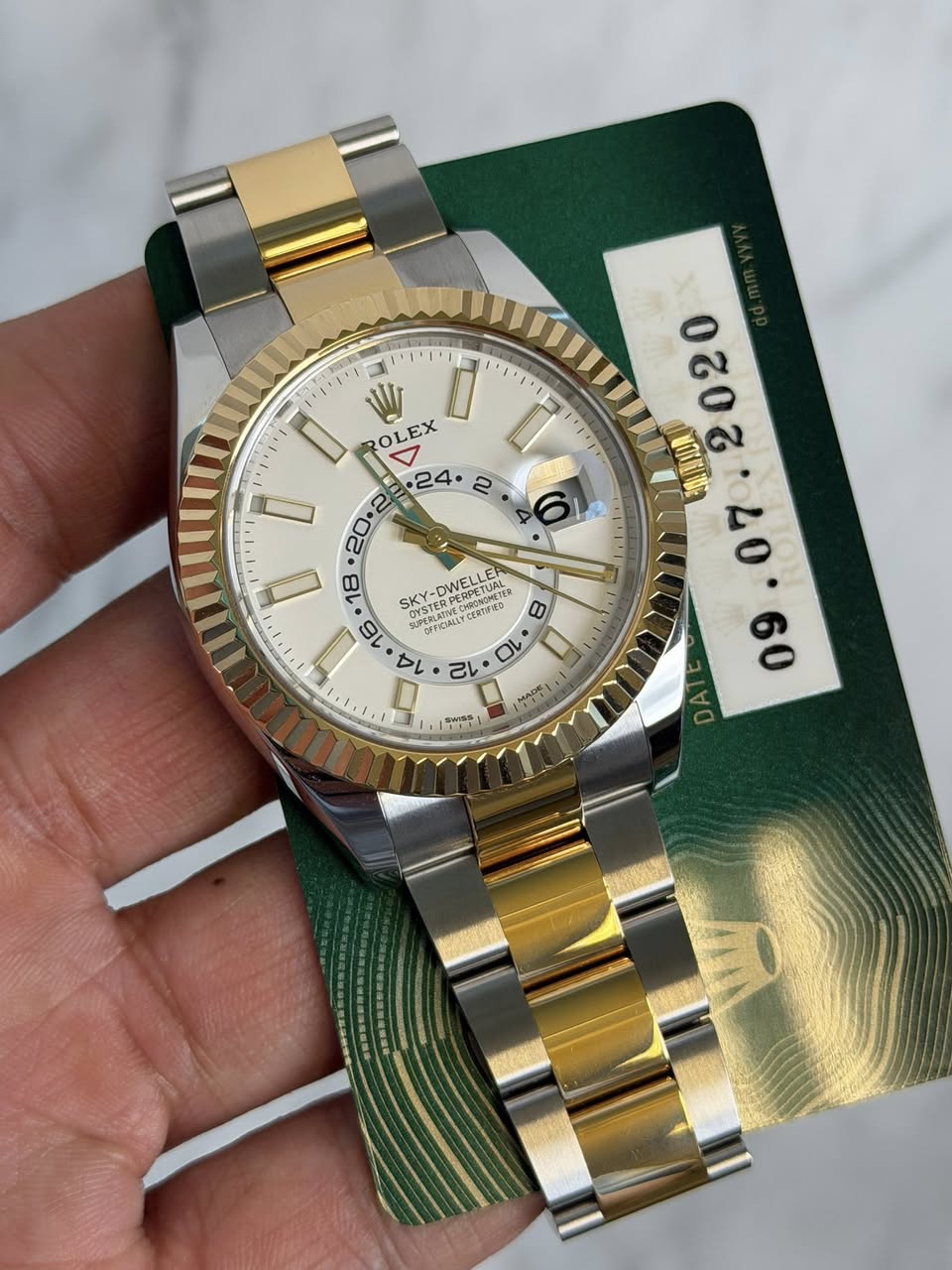May be an image of wrist watch and text