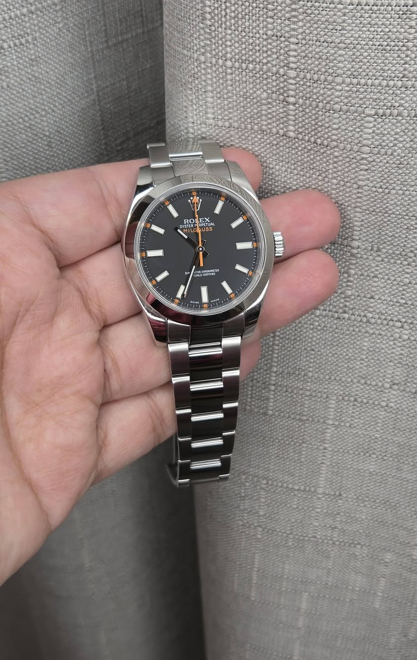 May be an image of wrist watch and text
