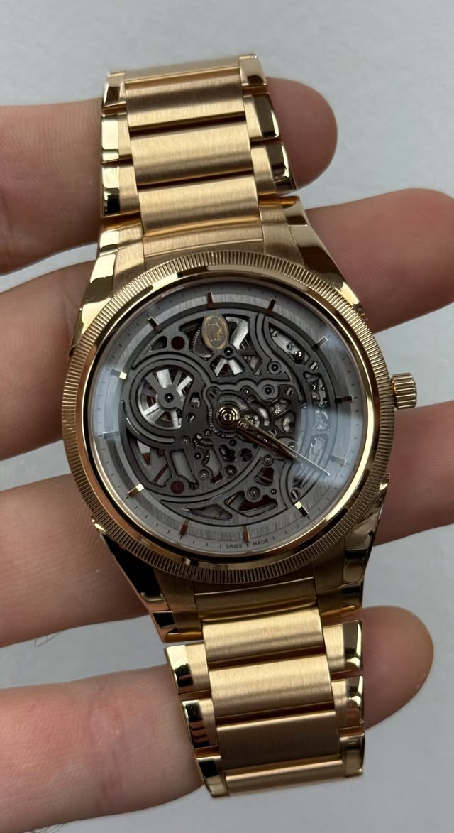 May be an image of wrist watch and text