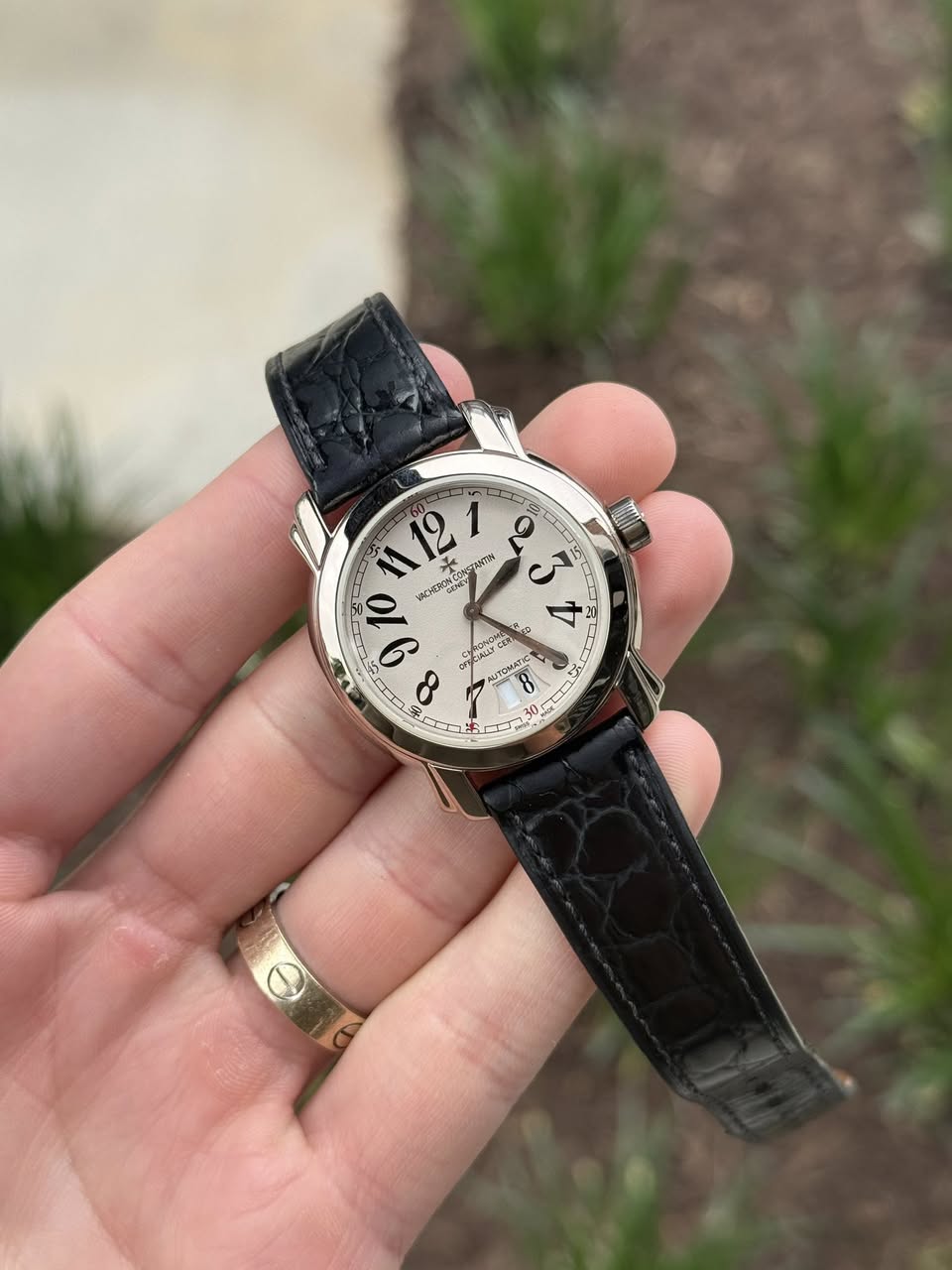 May be an image of wrist watch and text