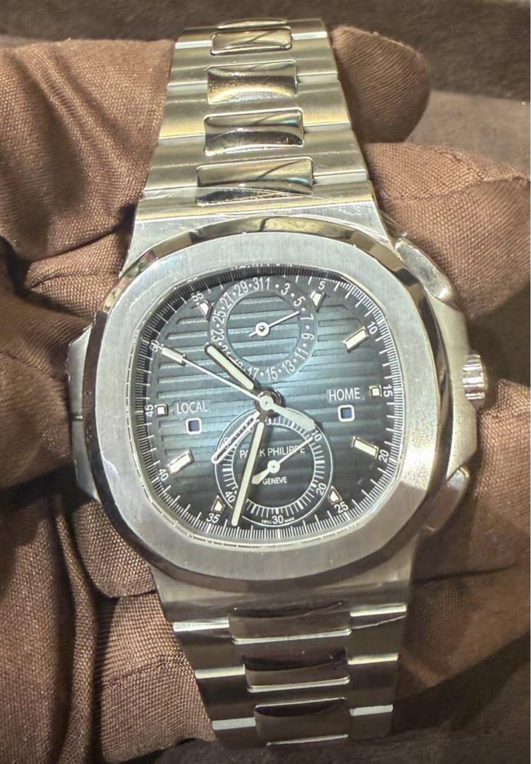 May be an image of wrist watch and text that says '3 5 باه መመ 10 6 15 HOME 5 15 45 D L LOCAL 45 ya 00 mty رالليوام P/ PHILIPP PHIL 20 GENEVE '