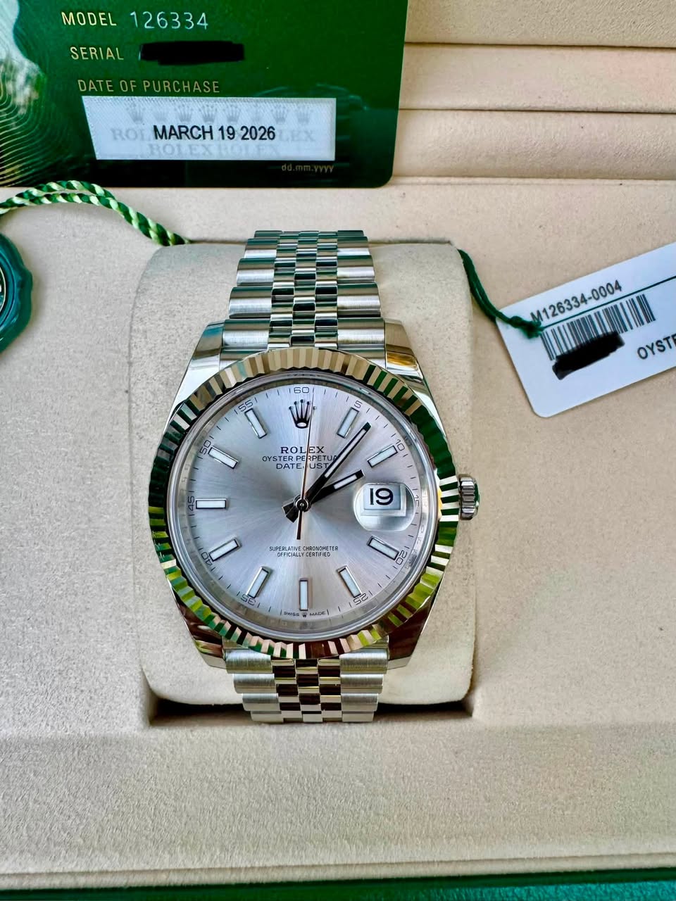 May be an image of wrist watch and text