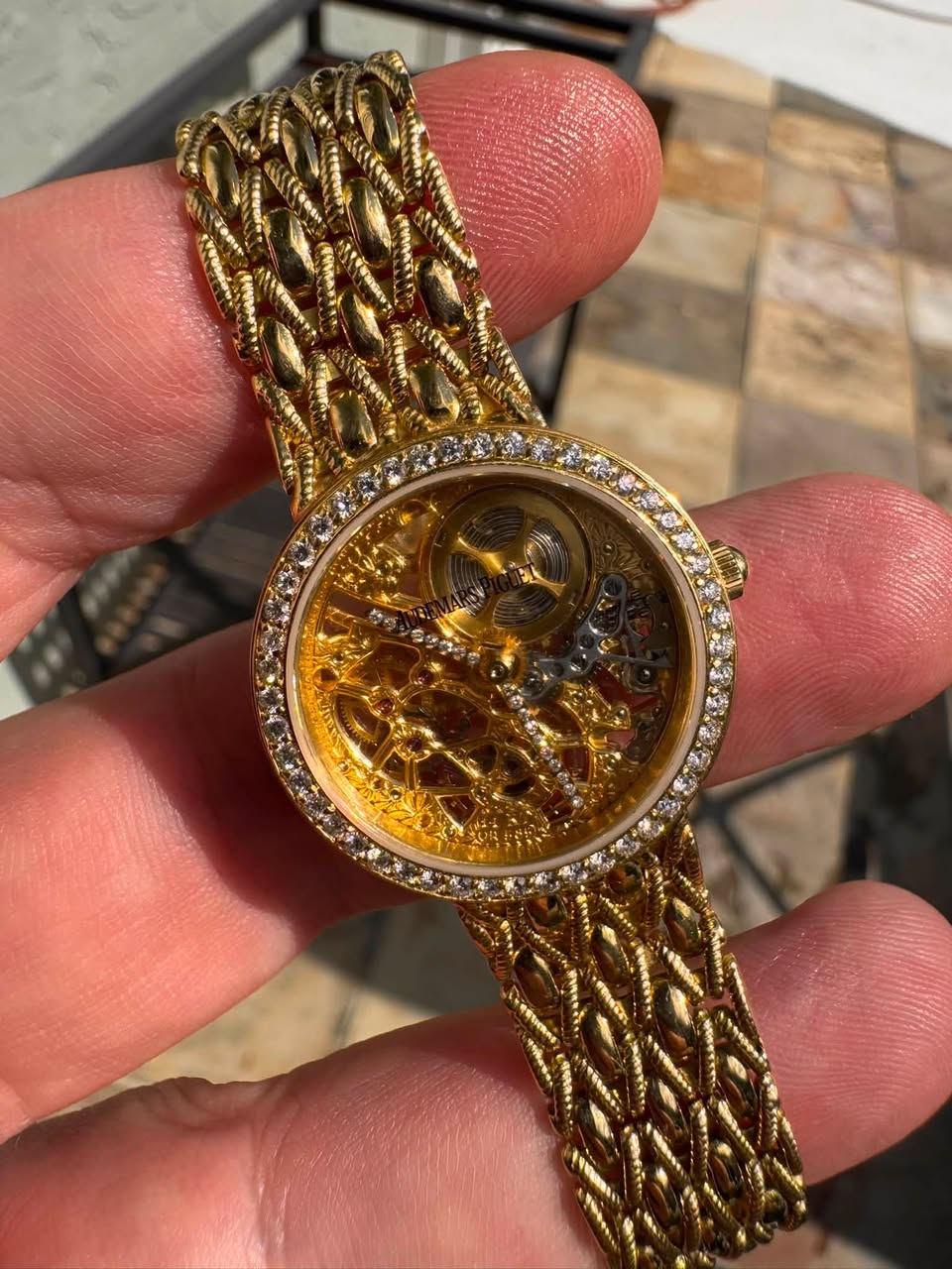May be an image of wrist watch and text
