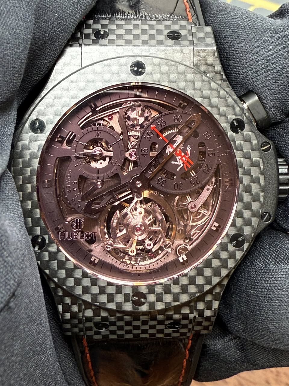 May be an image of wrist watch and text