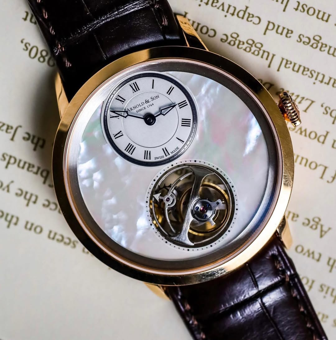 May be an image of wrist watch and text