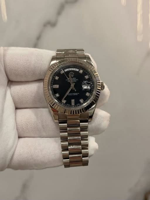 May be an image of wrist watch and text