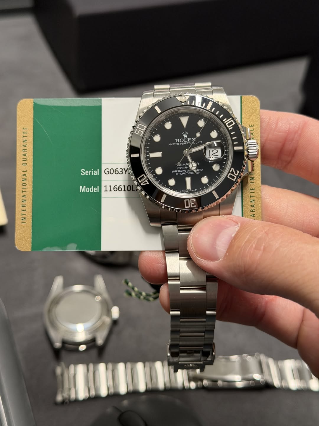 May be an image of wrist watch and text that says '50 10 D ROLEX ROLEX жή Ⅰ 12 8MA 0 Serial SerialG063Y G063Y 40 Model11661 Model 11661 L A AA GUARANTEE INTERNATIONAL 30 20…