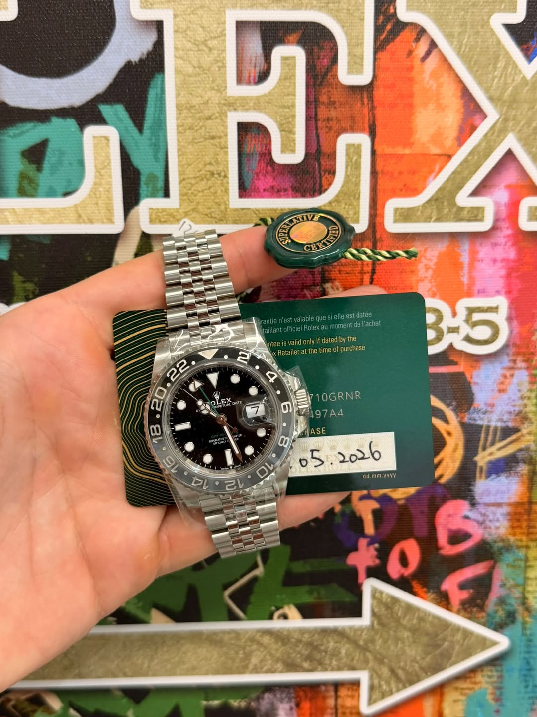 May be an image of wrist watch and text