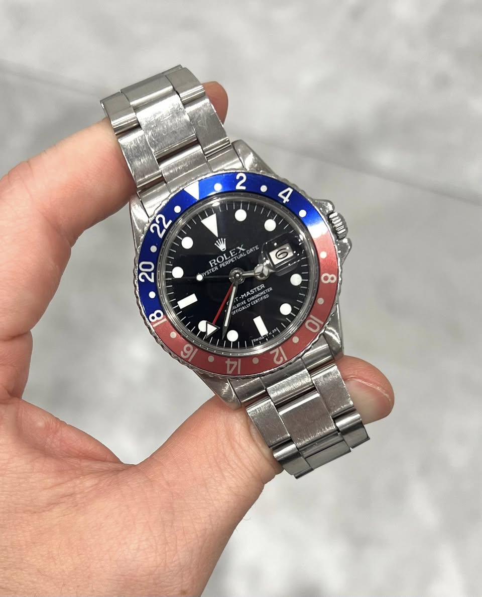 May be an image of wrist watch and text