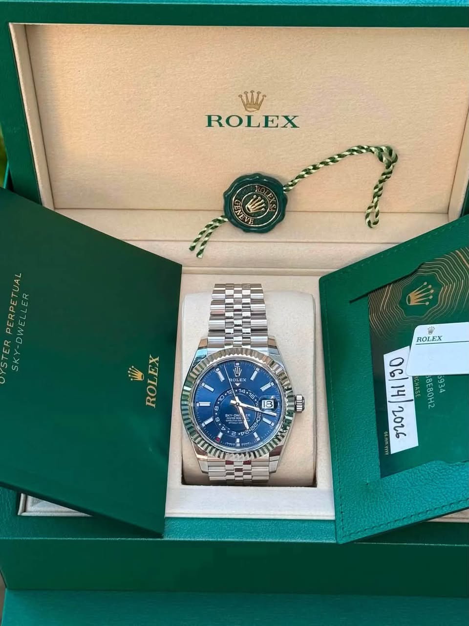 May be an image of wrist watch and text