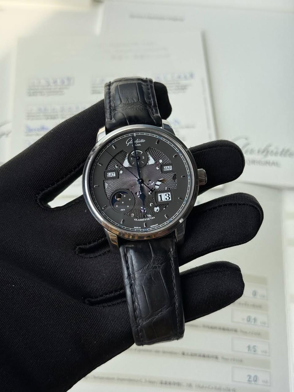 May be an image of wrist watch and text