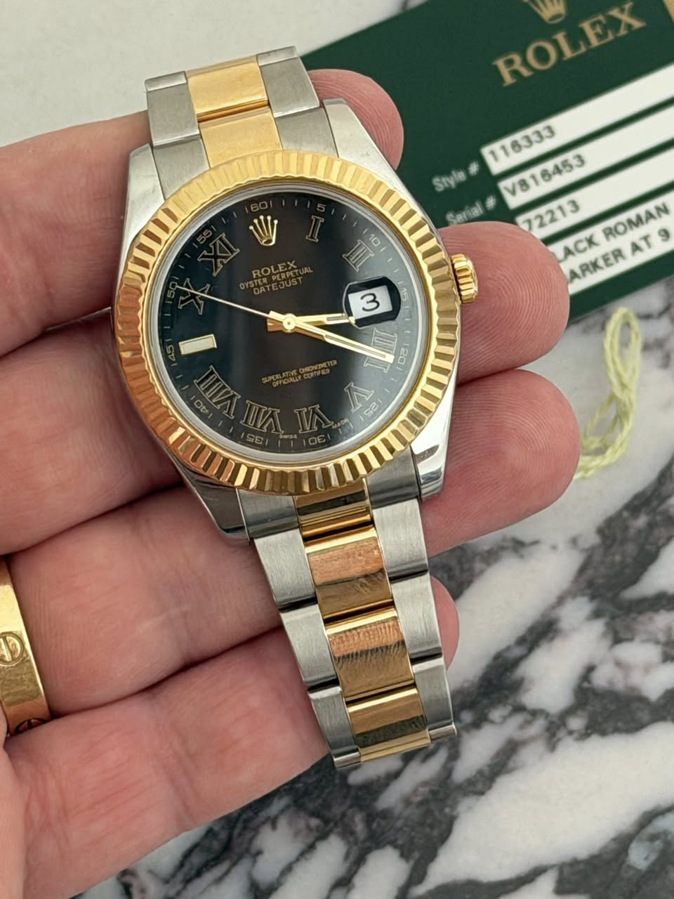 May be an image of wrist watch and text that says 'ROI ROLEX EX Style Sarial V ROLEX IIL V816453 72213 ROMAN LACK ARKERAT9 AT ARKER 3 O 20 GB D'