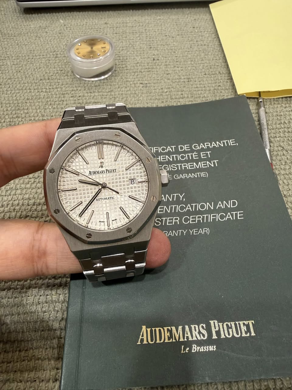May be an image of wrist watch and text