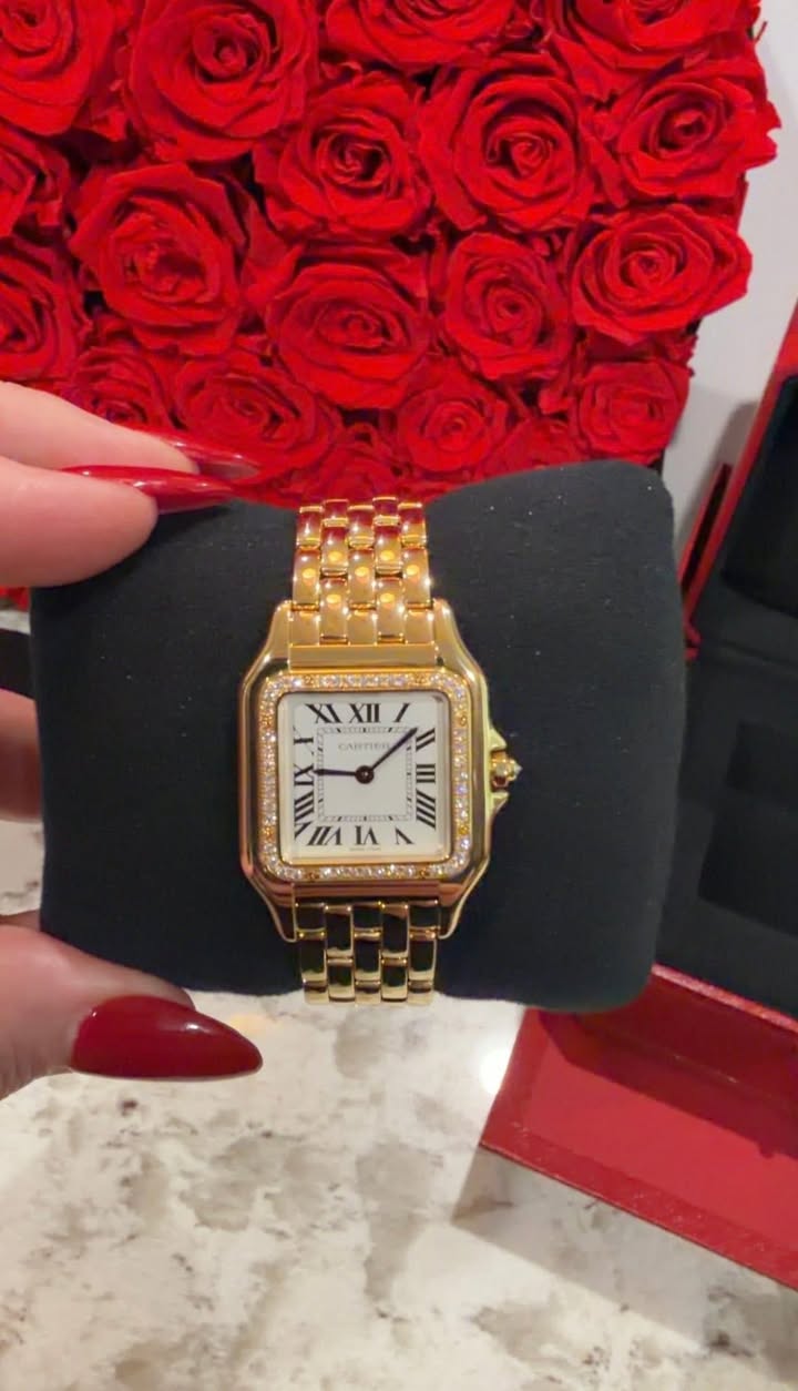 May be an image of wrist watch and text