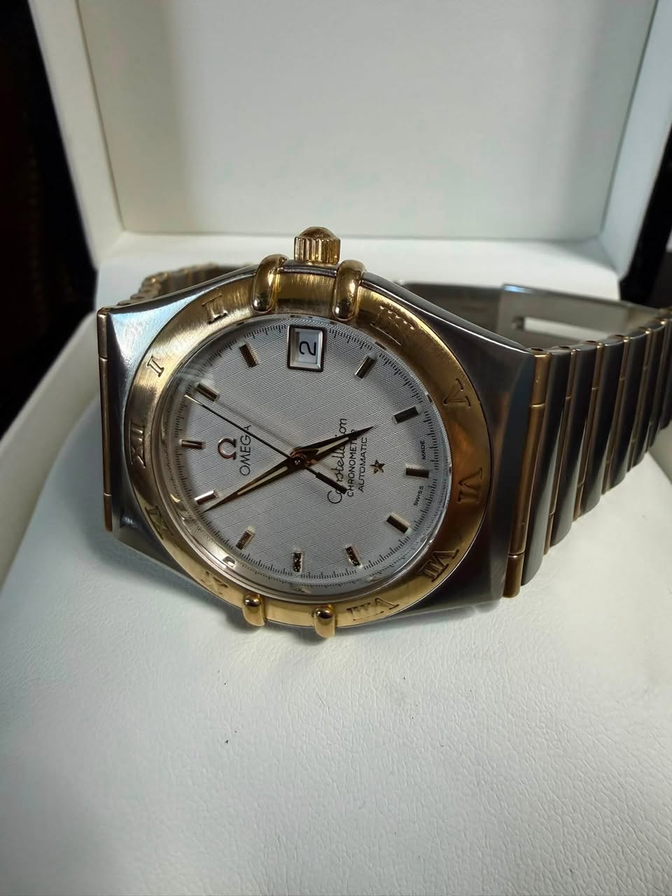 May be an image of wrist watch and text