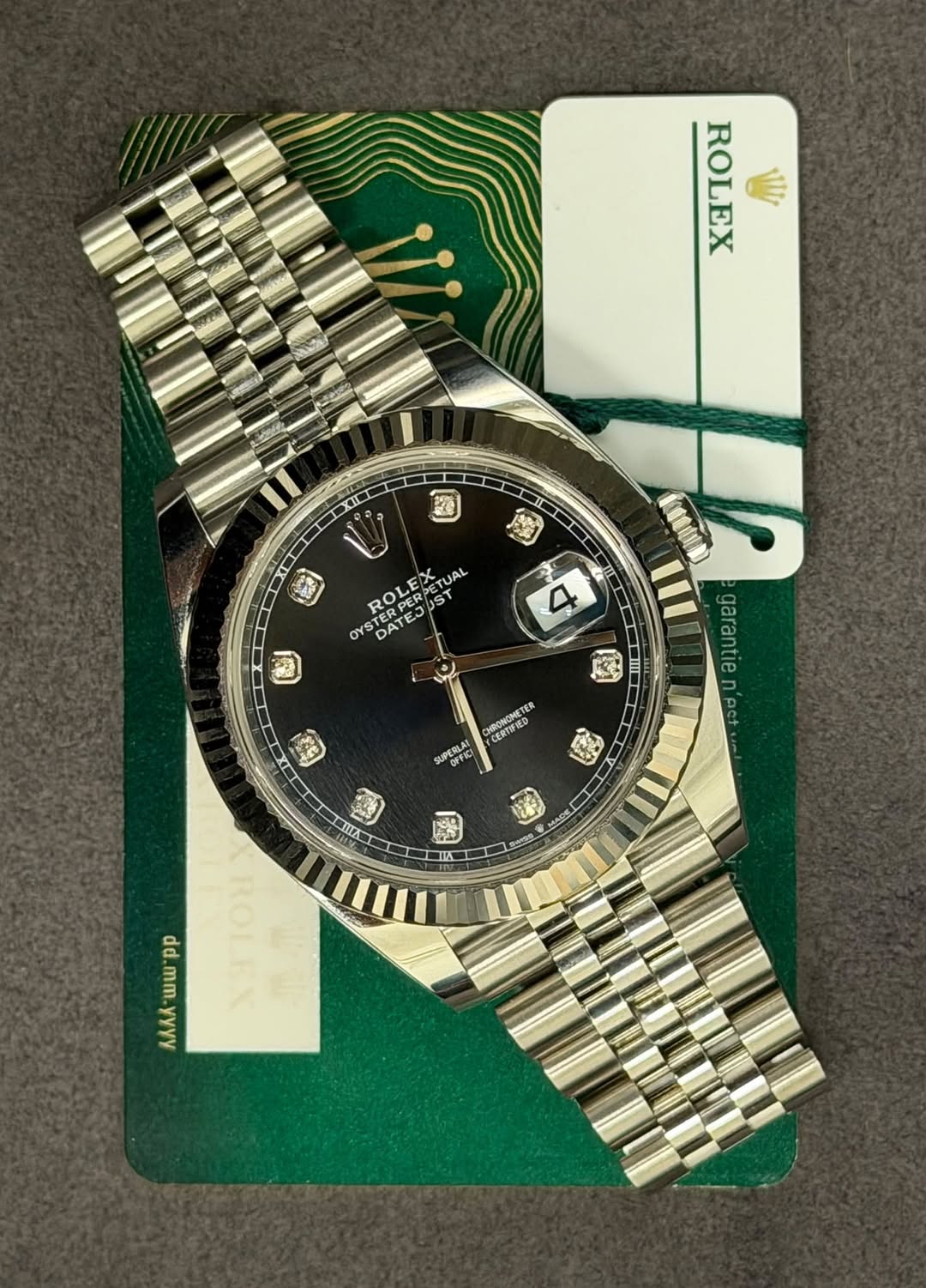 May be an image of wrist watch and text