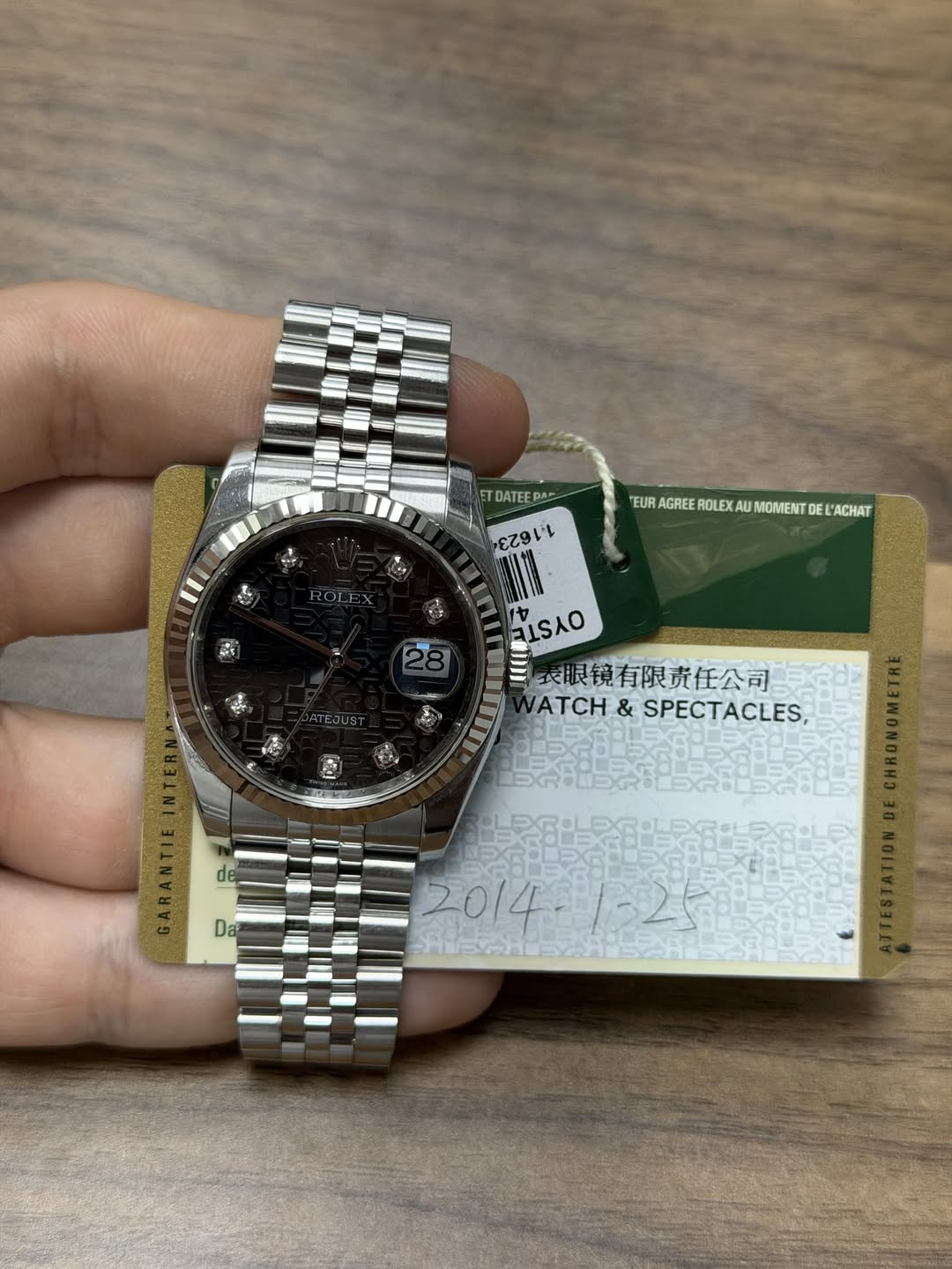May be an image of wrist watch and text