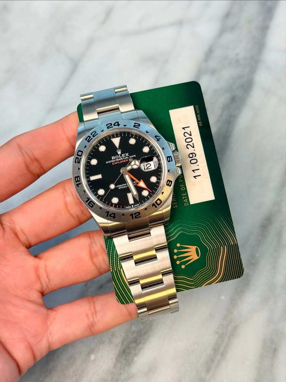 May be an image of wrist watch and text