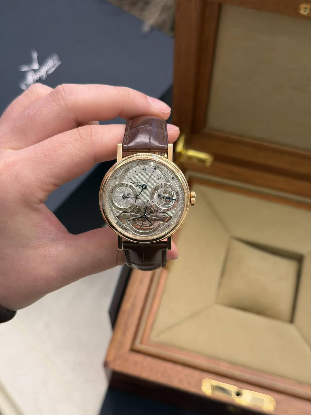 May be an image of wrist watch and text