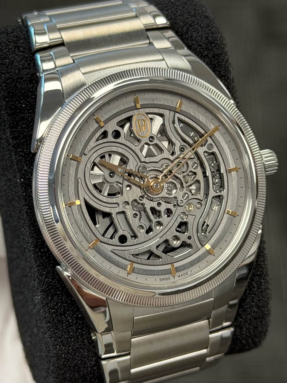 May be an image of wrist watch and text
