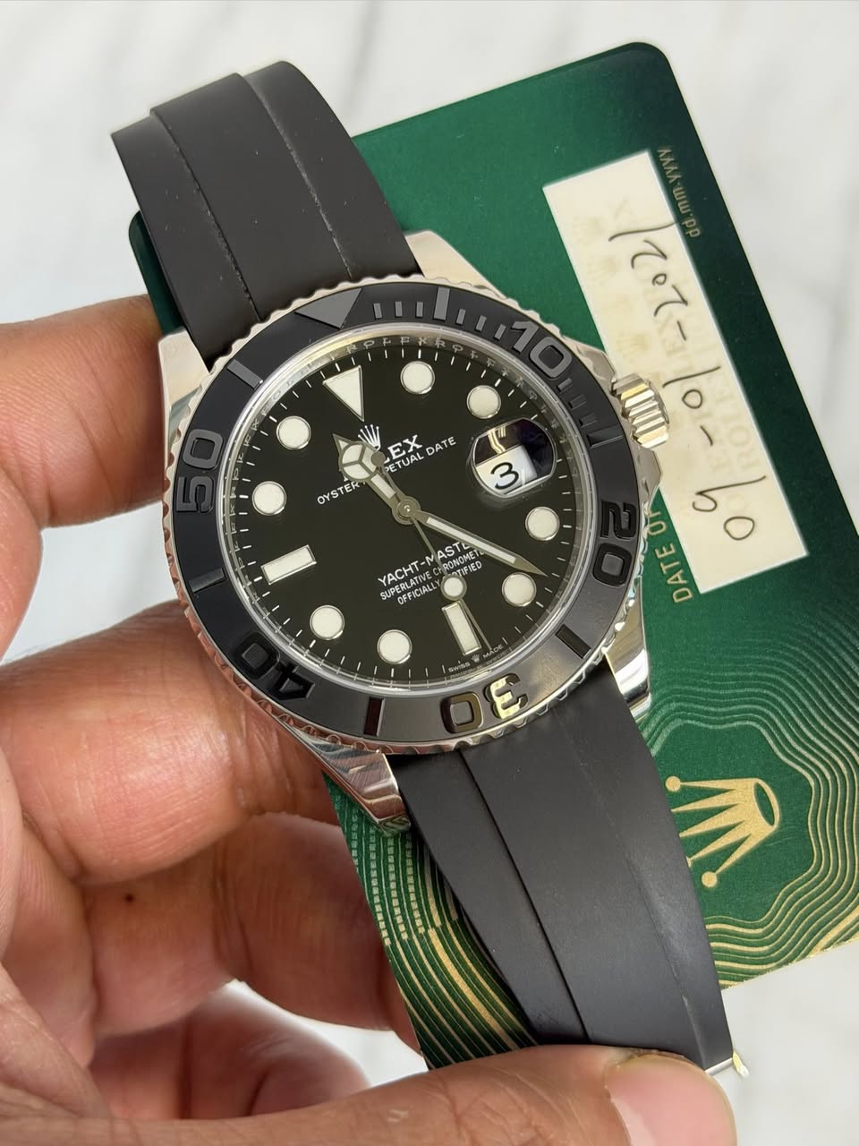 May be an image of wrist watch and text that says 'HT7o ててー EX DATE TE TE DATE E ETUAL UAL OYSTER TER OYS وا 3 AST RONOMET meMe 北 YACHT- SUPERLATIVE UPE N CUOEBLATIE TIFIED…