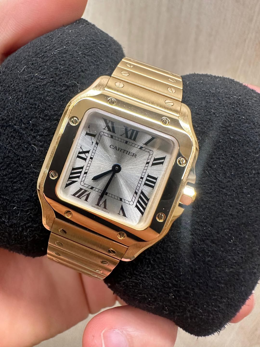 May be an image of wrist watch and text