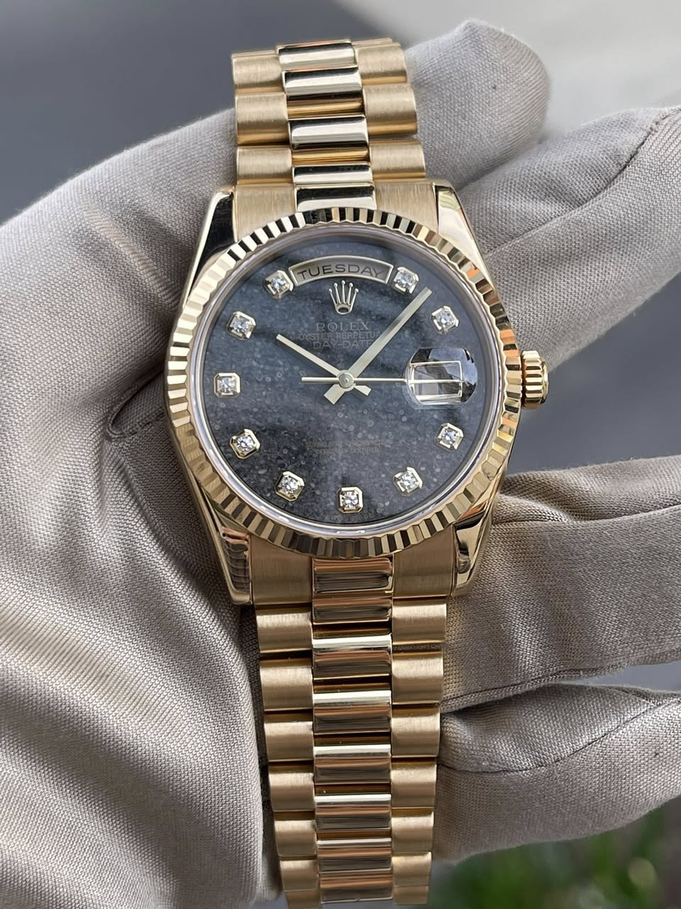 May be an image of wrist watch and text
