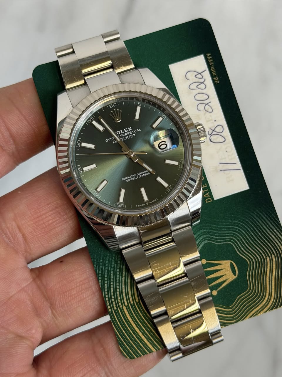 May be an image of wrist watch and text that says '160 10 ዓር0 OLEA PERPET OLEX PERPETU UAL OYS D JUST B O mII 45 SUPERCIAL CETP OV Os V GE on'