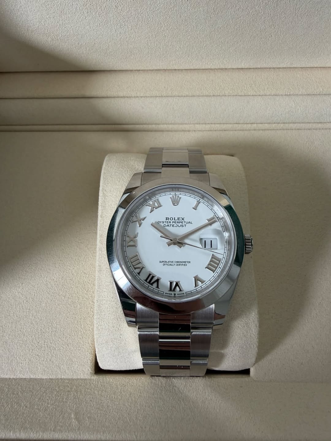 May be an image of wrist watch and text