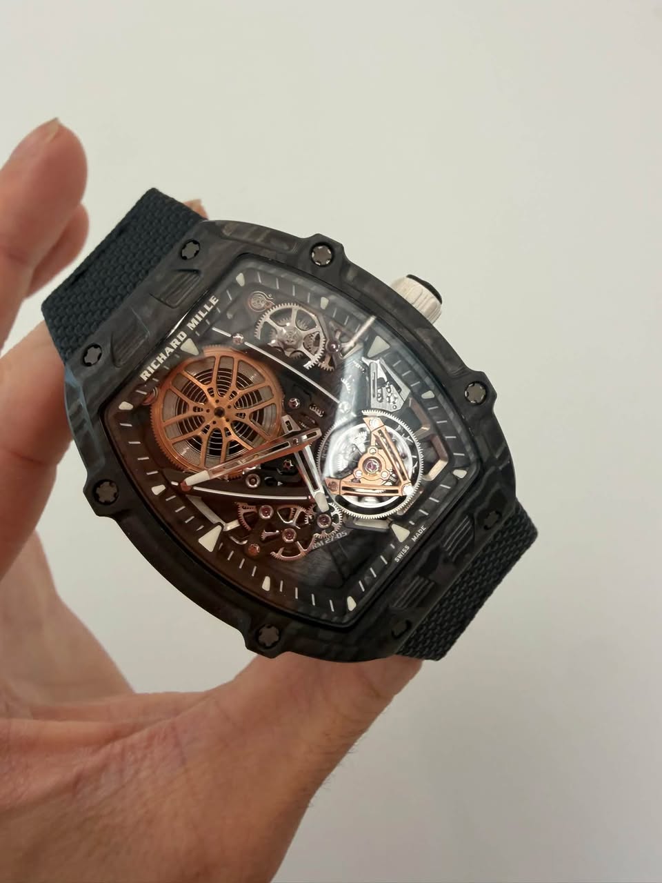 May be an image of wrist watch and text