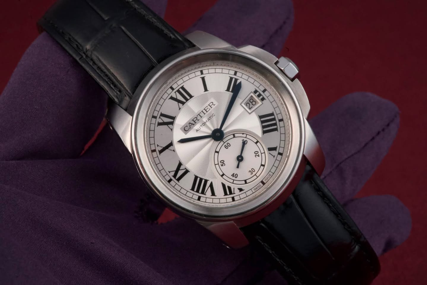 May be an image of wrist watch and text that says 'XII I XI CARTIER AUTOMA AUTOMATIC ATIC 60 88 Ⅲ 20 IX VIII ㅆ 50 40 30 JUYH ENESS 5'