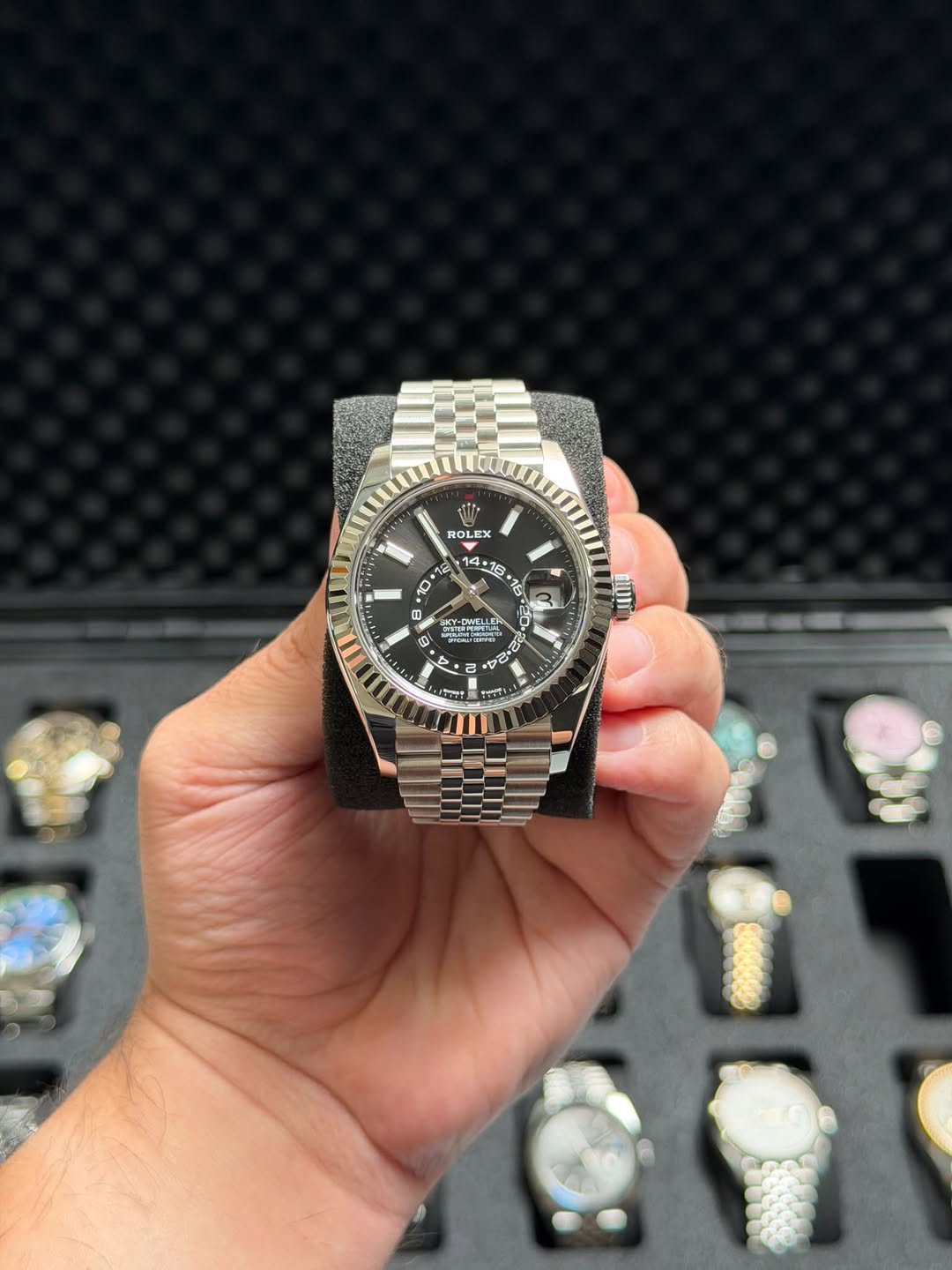May be an image of wrist watch and text