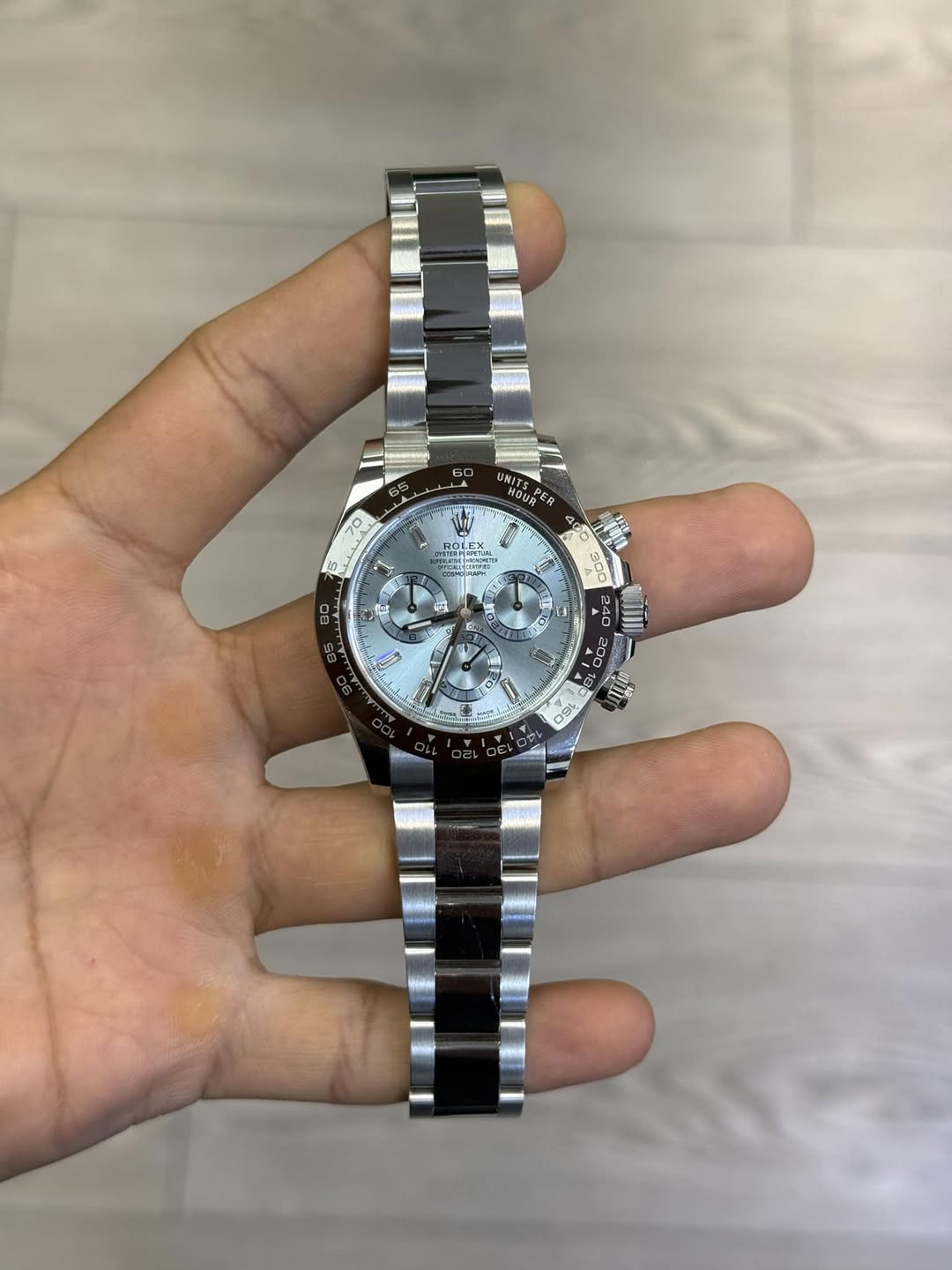 May be an image of wrist watch and text