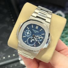 May be an image of wrist watch and text that says '۱ SAT Sti PATEK GENEVE PATEKPHILIPPE PPE OV ဟ JANA / J 9 1 الال ے Ta N 9 5.13 1 VND'